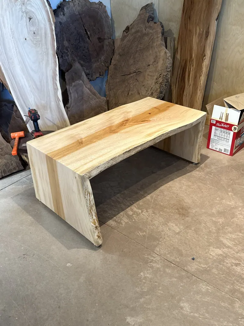 Waterfall-edge wood bench in the workshop.