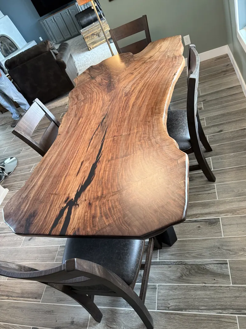 Live-edge wood tabletop with prominent natural grain.